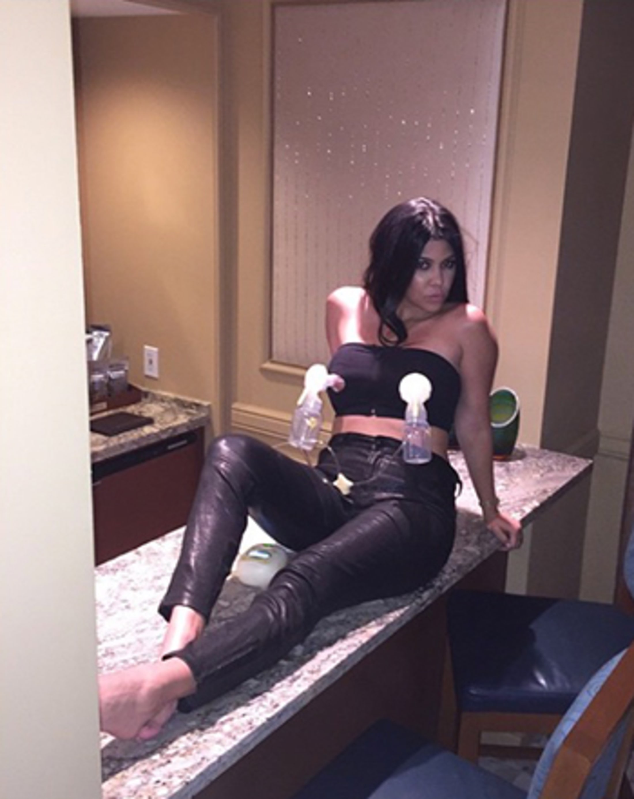 http://img.wennermedia.com/2200-width/1429475215_kourtney-kardashian-breast-pump_3.jpg