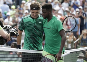 Roger Federer, Frances Tiafoe Roger Federer, of Switzerland, left, meets Frances Tiafoe at the net after their match during the Miami Open tennis tournament, in Key Biscayne, Fla. Federer won 7-6 (2), 6-3 Tennis, Key Biscayne, U