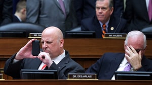 WASHINGTON, DC - MARCH 05: House Oversight and Government Reform Committee member Rep. Scott Desjarlais (R-TN) (L) makes a photograph with his iPhone during a hearing in the Rayburn House Office Building with Rep. Pat Meehan (R-PA) March 5, 2014 in Washington, DC. Chairman Darrell Issa (R-CA) adjuourned after the witness, former Internal Revenue Service official Lois Lerner, exercised her Fifth Amendment right not to speak about the IRS targeting investigation during the hearing. (Photo by Chip Somodevilla/Getty Images)