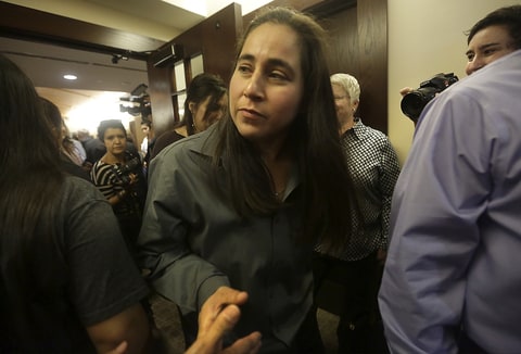 San Antonio, TX, USA - A teary eyed Anna Vasquez is greeted by well wishers as she leaves the 175th District Court where family and friends of Elizabeth Ramirez, Cassandra Rivera and Kristie Mayhugh gathered in the Cadena Reeves Justice Center to hear that the 3 women were released from prison. Monday, Nov. 18, 2013. Anna Vasquez, was released on parole from prison just over a year ago
