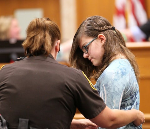 Anissa Weier is led out of the courtroom by a sheriff's deputy on Aug. 21, 2015 during the arraignment of the Slenderman stabbing trial in Waukesha County Court in Waukesha, Wis.