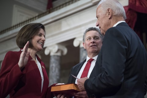 Washington, District of Columbia, U.S. - UNITED District of ColumbiaS - JANUARY 03: Sen. Catherine Cortez Masto, D-Nev., is administered an oath as her husband Paul looks on, by Vice President Joe Biden during a swearing-in ceremony in the Capitol's Old Senate Chamber, January 03, 2017.