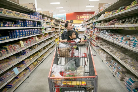 AUSTIN, TEXAS - December 20, 2016: Vicky Badillo and her son David, 6, shop for groceries in Austin. Ilana Panich-Linsman for RollingStone.com