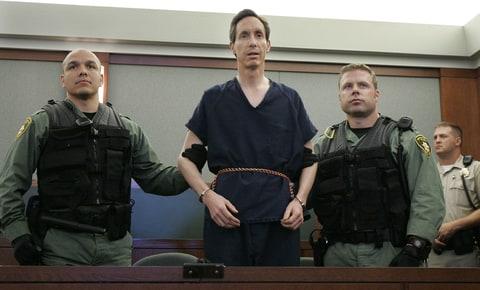 In this Aug. 31, 2006 file photo, Warren Jeffs appears in a courtroom surrounded by guards in Las Vegas. The Utah Supreme Court on Tuesday, July 27, 2010 reversed the convictions of polygamist leader Warren Jeffs and ordered a new trial.