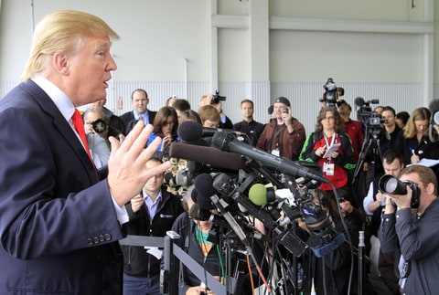 Donald Trump, a possible 2012 presidential candidate, talks to reporters after arriving at the Pease International Tradeport Wednesday, April 27, 2011 in Portsmouth, N.H. Trump said he was