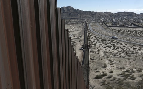 A truck drives near the Mexico-US border fence, on the Mexican side, separating the towns of Anapra, Mexico and Sunland Park, New Mexico, Wednesday, Jan. 25, 2017. U.S. President Donald Trump will direct the Homeland Security Department to start building a wall at the Mexican border.