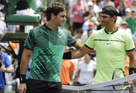 Roger Federer poses with Rafael Nadal during the Men's finals at the Miami Open held at the Crandon Park Tennis Center on April 2, 2017 in Key Biscayne, Florida