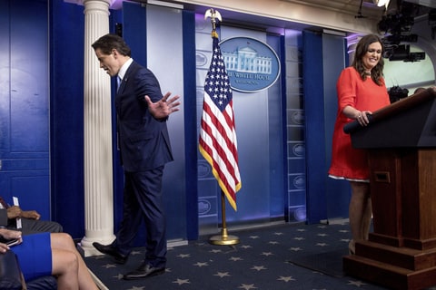 Newly appointed White House press secretary Sarah Huckabee Sanders, right, smiles as Anthony Scaramucci, incoming White House communications director, center, departs the daily press briefing at the White House, Friday, July 21, 2017, in Washington. White House press secretary Sean Spicer has resigned. (