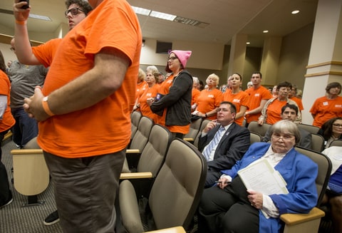 Gun lobbyist Marion Hammer, right, and Eric Friday, general counsel for Florida Carry, sit among protesters during the Senate Rules Committee meeting on gun safety at the Florida state Capitol after a rally in Tallahassee on February 26th, 2018.