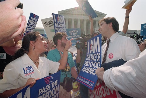 Abortion activists pro and con confront each other outside the U.S. Supreme Court Building in Washington, June 30, 1992, after the court upheld most of Pennsylvania's restrictive abortion laws