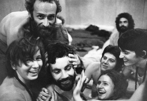 Bhaghwan cult members massaging each other.