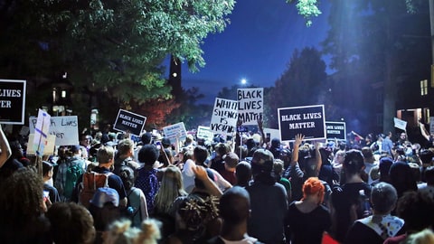 ST LOUIS, MO - SEPTEMBER 16: Demonstrators protesting the acquittal of former St. Louis police officer Jason Stockley march through University City on September 16, 2017 in St. Louis, Missouri. Dozens of business windows were smashed and at least two police cars were damaged during a second day of protests following the acquittal of Stockley, who had been charged with first-degree murder last year following the 2011 on-duty shooting of Anthony Lamar Smith. (Photo by Scott Olson/Getty Images)