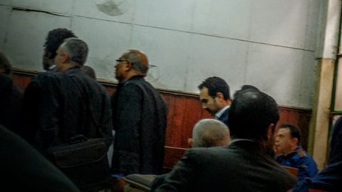 Egyptian author Ahmed Naji, center background, attends a court hearing in Cairo, Egypt, Saturday, Feb. 20, 2016. Naji was sentenced to two years in jail on Saturday by a Cairo appeals court for publishing a sexually explicit excerpt of his novel that prosecutors said violated “public modesty.” Naji was initially acquitted by another court, but prosecutors appealed the verdict.