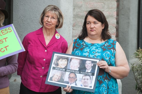 5th March 2013. Tucson shooting victims PAM SIMON, left, and MARY REED, right, attended an event held outside the Tucson, Ariz. office of Sen. J. Flake (R-Ariz.) calling for a non-partisan approval of universal background checks for firearm purchases. The event was organized by several groups including the Tucson Community Committee Against Gun Violence, Mayors Against Illegal Guns and The National Coalition to Stop Gun Violence.
