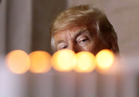 WASHINGTON, DC - APRIL 25: U.S. President Donald Trump watches as candles are lit during the U.S. Holocaust Memorial Museum's