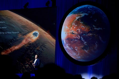 Elon Musk, chief executive officer for Space Exploration Technologies Corp. (SpaceX), speaks during the 67th International Astronautical Congress (IAC) in Guadalajara, Mexico, on Tuesday, Sept. 27, 2016. Musk's vision for building a self-sustaining city on Mars will require full rocket reusability, refueling the spacecraft in orbit and propellant production on the Red Planet.