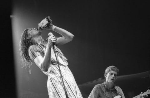 Gibby Haynes of Butthole Surfers drinks from a whiskey bottle on stage at the Pandorra Festival in Rotterdam, Netherlands on October 12 1985.