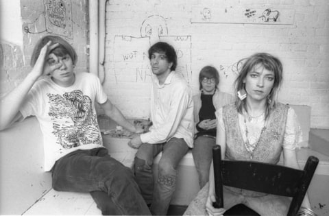 A group portrait of American rock band Sonic Youth, (L-R) Thurston Moore, Lee Ranaldo, Steve Shelley and Kim Gordon, posing backstage at Paradiso on May 11 1986 in Amsterdam, Netherlands.