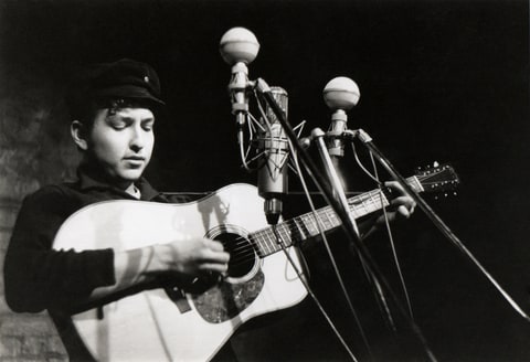 Bob Dylan performs at The Bitter End folk club in Greenwich Village in 1961 in New York City, New York.