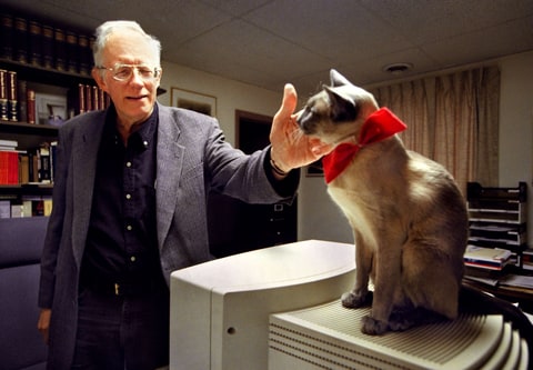 William Pierce, founder of the (White Power group) National Alliance, is the new owner of Resistance Records. In his office, Pierce pets his 8-year-old Blue Point Siamese cat named Hadley. Photographed January 4, 2000 in Hillsboro, WV.