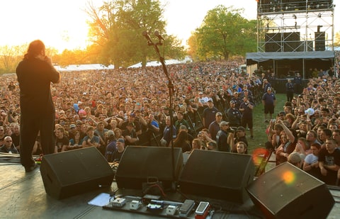 Actor Ron Jeremy performs The Star Spangled Banner during Rockfest 2013 at Liberty Memorial on May 11, 2013 in Kansas City, Missouri.
