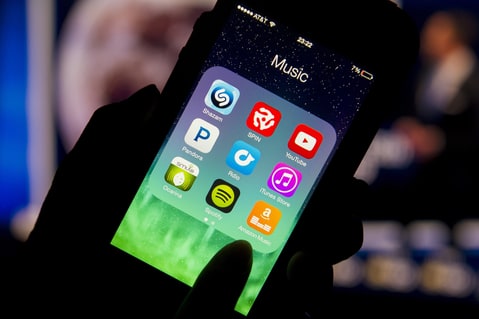 The Amazon.com Inc. Prime Music mobile app is displayed on an Apple Inc. iPhone 5 for a photograph in San Francisco, California, U.S., on Thursday, June 12, 2014. Amazon.com Inc. introduced advertising-free music streaming with more than a million songs, ramping up competition against Apple Inc., Spotify Ltd. and Pandora Media Inc