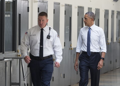 US President Barack Obama, alongside Ronald Warlick (L), a correctional officer, tours a cell block at the El Reno Federal Correctional Institution in El Reno, Oklahoma, July 16, 2015. Obama is the first sitting US President to visit a federal prison, in a push to reform one of the most expensive and crowded prison systems in the world.