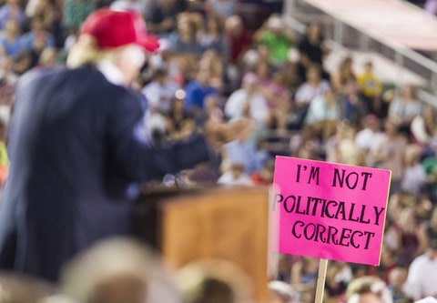 supporter holds up a sign as Republican presidential candidate Donald Trump speaks during a rally at Ladd-Peebles Stadium on August 21, 2015 in Mobile, Alabama. The Trump campaign moved tonight's rally to a larger stadium to accommodate demand.