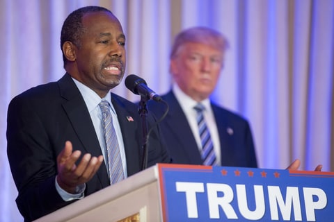 Ben Carson, retired neurosurgeon and former 2016 Republican presidential candidate, left, speaks as Donald Trump, president and chief executive of Trump Organization Inc. and 2016 Republican presidential candidate, right, listens during a news conference at the Mar-A-Lago Club in Palm Beach, Florida, U.S., on Friday, March 11, 2016. Carson, who recently ended his quest for Republican presidential nomination, endorsed his onetime rival Donald Trump Friday striking a blow to presidential candidate Senator Ted Cruz, who had courted Carson because they appeal to many of the same religious-minded voters.