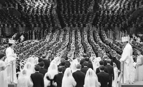 Unification Church leader Reverend Sun Myung Moon and his wife marry 2,075 pairs of his followers at Madison Square Garden on New Years Day, 1982.