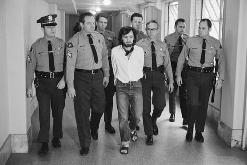 Seven deputies escort Charles Manson from the courtroom after he and three followers were found guilty of seven murders in the Tate-LaBianca slayings.