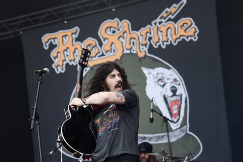 Josh Landau, member of the US band The Shrine, performs on stage during the Hellfest heavy metal and hard rock music festival on June 17, 2016 in Clisson, western France.