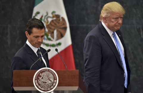 US presidential candidate Donald Trump (R) and Mexican President Enrique Pena Nieto prepare to deliver a joint press conference in Mexico City on August 31, 2016.