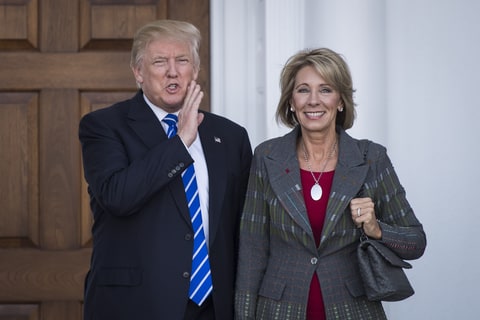 BEDMINSTER TOWNSHIP, NJ - NOVEMBER 19: President-elect Donald Trump stands with Betsy DeVos after a meeting at Trump National Golf Club Bedminster in Bedminster Township, N.J. on Saturday, Nov. 19, 2016.