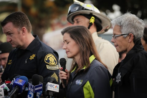 Oakland Mayor Libby Schaaf (C) speaks at a media event following a warehouse fire that has claimed the lives of at least thirty-three people on December 4, 2016 in Oakland, California. The fire took place during a musical event late Friday night.