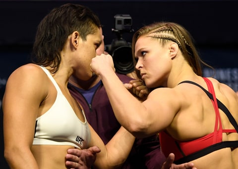 UFC women's bantamweight champion Amanda Nunes and Ronda Rousey face off during the UFC 207 weigh-in.