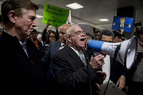From left, Rep. Don Beyer, D-Va., Rep. John Delaney, D-Md., Rep. Gerry Connolly, D-Va., and Rep. Jamie Raskin, D-Md., (not pictured here) speak to the press and protesters about possible detention of travelers and legal access at Dulles International Airport in Virginia on Sunday, Jan. 29, 2017. Protests erupted at airports around the country following President Trump's executive order restricting travel from several Islamic countries.
