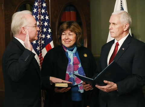U.S. Vice President Mike Pence (R) swears in Rep. Tom Price (R-GA)(L) as new the Health and Human Services Secretary, as his wife Betty Price holds a bible, on February 10, 2017 in Washington, DC. Yesterday Price was confirmed by the U.S. Senate.