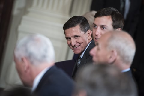National Security Adviser Michael Flynn talks to others before President Donald Trump and Canadian Prime Minister Justin Trudeau speak during a news conference in the East Room of the White House in Washington, DC on Monday, Feb. 13, 2017.