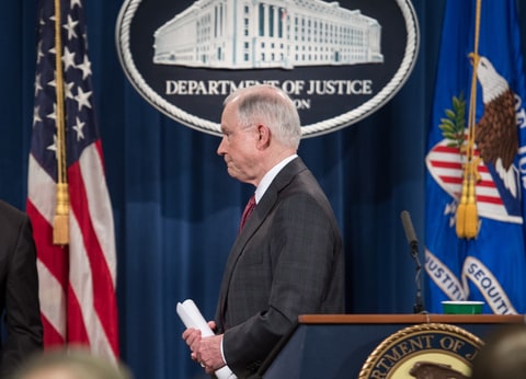 US Attorney General Jeff Sessions walks away after holding a press conference at the Justice Department in Washington, DC, on March 2, 2017. Sessions announced that he would recuse himself from any investigations into President Donald Trump's 2016 election campaign. But after receiving a strong endorsement from Trump, Sessions did not bow to pressure to step down over charges he lied to Congress about his contacts with the Russian ambassador before the election.