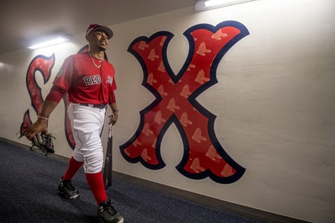 Mookie Betts #50 of the Boston Red Sox walks through the hallway on his way to the field before a Spring Training game against the Tampa Bay Rays on March 2, 2017 at Fenway South in Fort Myers, Florida .
