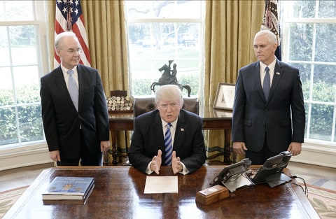 U.S. President Donald Trump reacts with HHS Secretary Tom Price (L) and Vice President Mike Pence (R) after Republicans abruptly pulled their health care bill from the House floor, in the Oval Office of the White House on March 24, 2017 in Washington, DC. In a big setback to the agenda of President Donald Trump and the Speaker, Ryan cancelled a vote for the American Health Care Act, the GOP plan to repeal and replace the Affordable Care Act, also called 'Obamacare.'