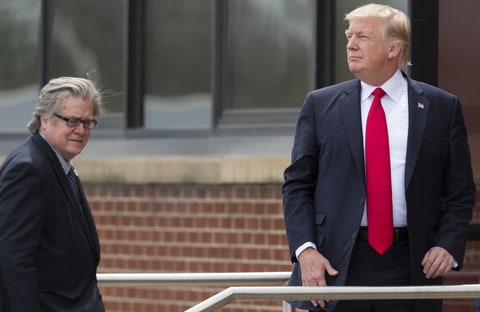 US President Donald Trump stands alongside Chief Strategist Stephen Bannon (L) upon arrival at Snap-On Tools in Kenosha, Wisconsin, April 18, 2017, prior to signing the Buy American, Hire American Executive Order.