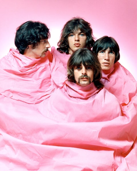 Psychedelic rock group Pink Floyd pose for a portrait shrouded in pink in August of 1968 in Los Angeles. (L-R) Nick Mason, Dave Gilmour, Rick Wright (center front), Roger Waters.