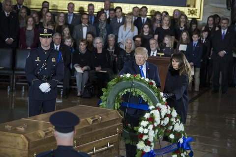 President Donald Trump and First Lady Melania Trump pay respects during a ceremony in the Capitol Rotunda as the late Rev. Billy Graham lies in honor on February 28, 2018.