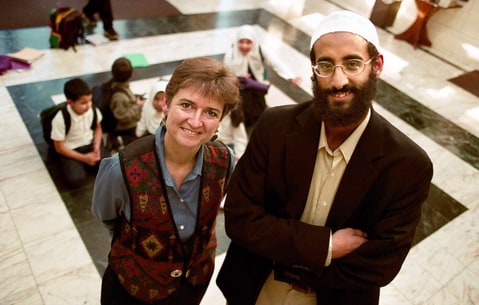 Imam Anwar Al Awlaki at the Dar al Hijrah Mosque in Falls Church, Virginia, in 2001. At the time he was persuing a doctorate at George Washington University.. In background are students at the Islamic School. For a story on non-Muslims reaching out to Muslims