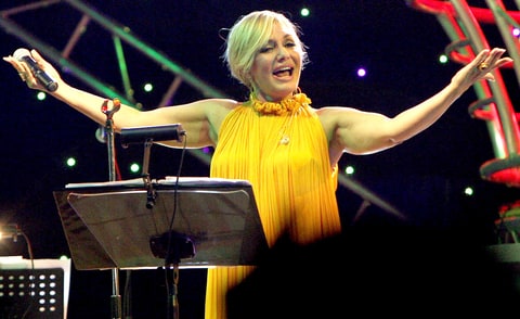 Iranian singer Googoosh, whose real name is Faegheh Atashin, salutes the audience during a rare concert she gave in the Iraqi Kurdish city of Arbil, 320 kms (200 miles) north of Baghdad, late on September 12, 2010. The popular Persian diva was banned from singing along with all female preformers in Iran after the establishment of the Islamic republic in 1979, but she resumed her performances abroad ten years ago.