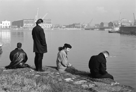 Archive photograph of world famous Irish rock band U2, pictured beside the River Thames during their visit to Britain as part of their 18 month world tour. (From left to right) lead guitarist David Evans, bassist Adam Clayton, drummer Larry Mullen and lead sin