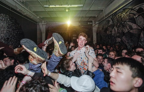 Crowd of fans at 285 Kent in Williamsburg, Brooklyn during Fucked Up's performance on September 26, 2014. The DIY venue was forced to shut down due to the areas increasing property value.