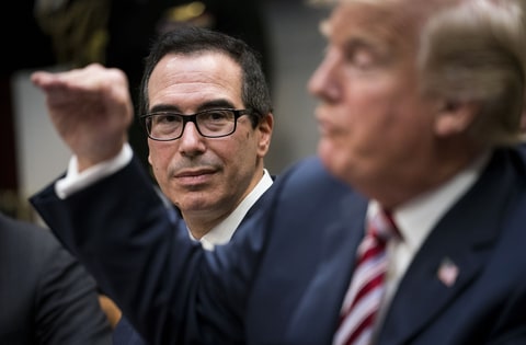 Treasury Secretary Steven Mnuchin looks on as President Donald Trump speaks during a meeting with business leaders about tax policy in the Roosevelt Room of the White House, in Washington, Oct. 31, 2017.